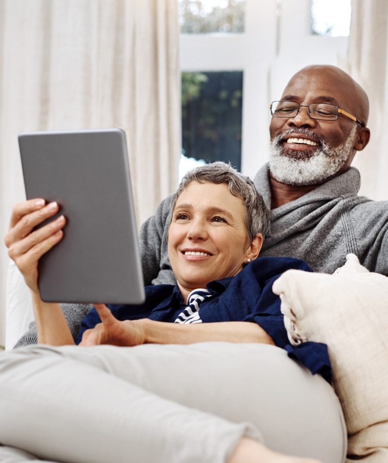 Elder couple on tablet searching Closings